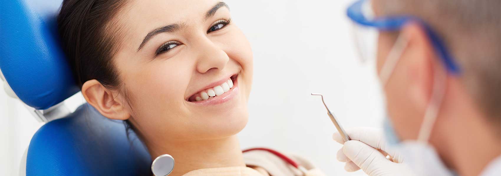 Beautiful woman smiling while dental treatments